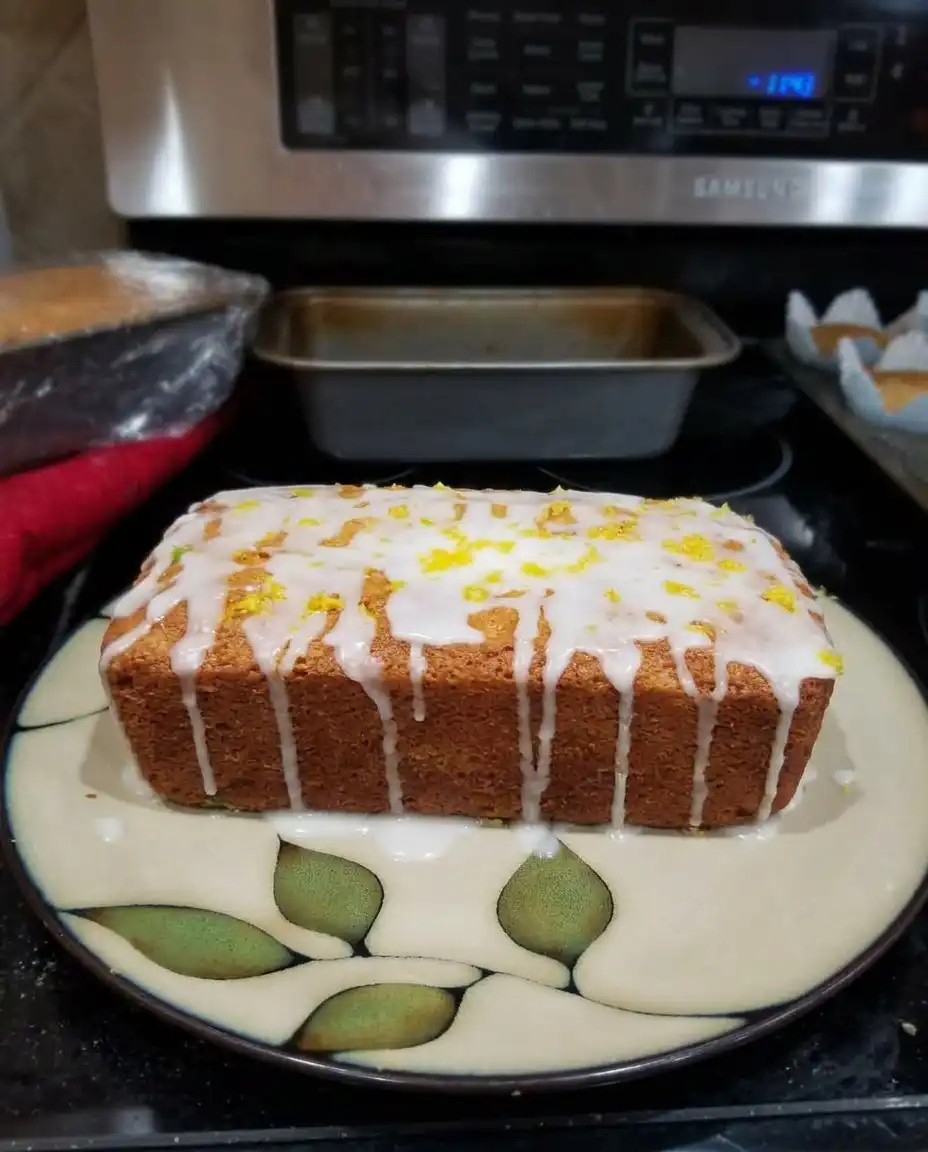 Mini loaves of lemon zucchini bread topped with a tangy glaze