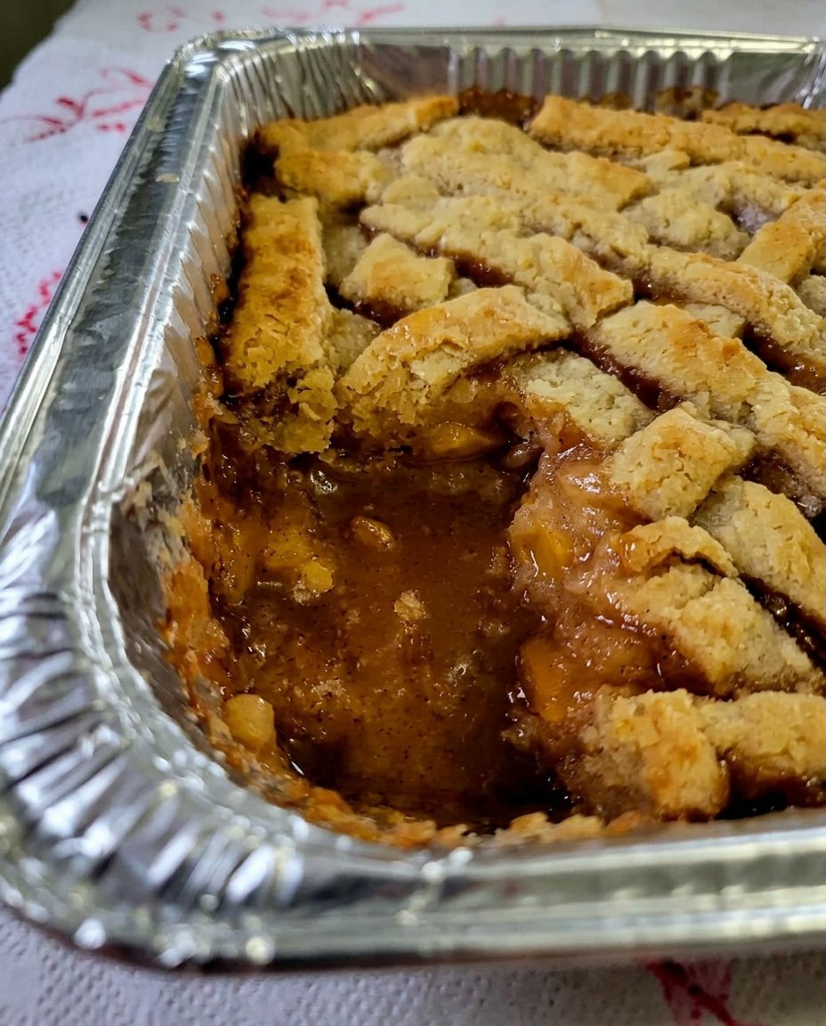 Close up of the textured crust of a peach cobbler.