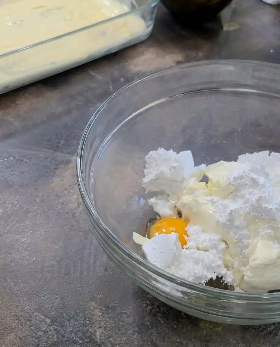 A collection of ingredients including peach pie filling and cream cheese for Peaches and Cream Bars.