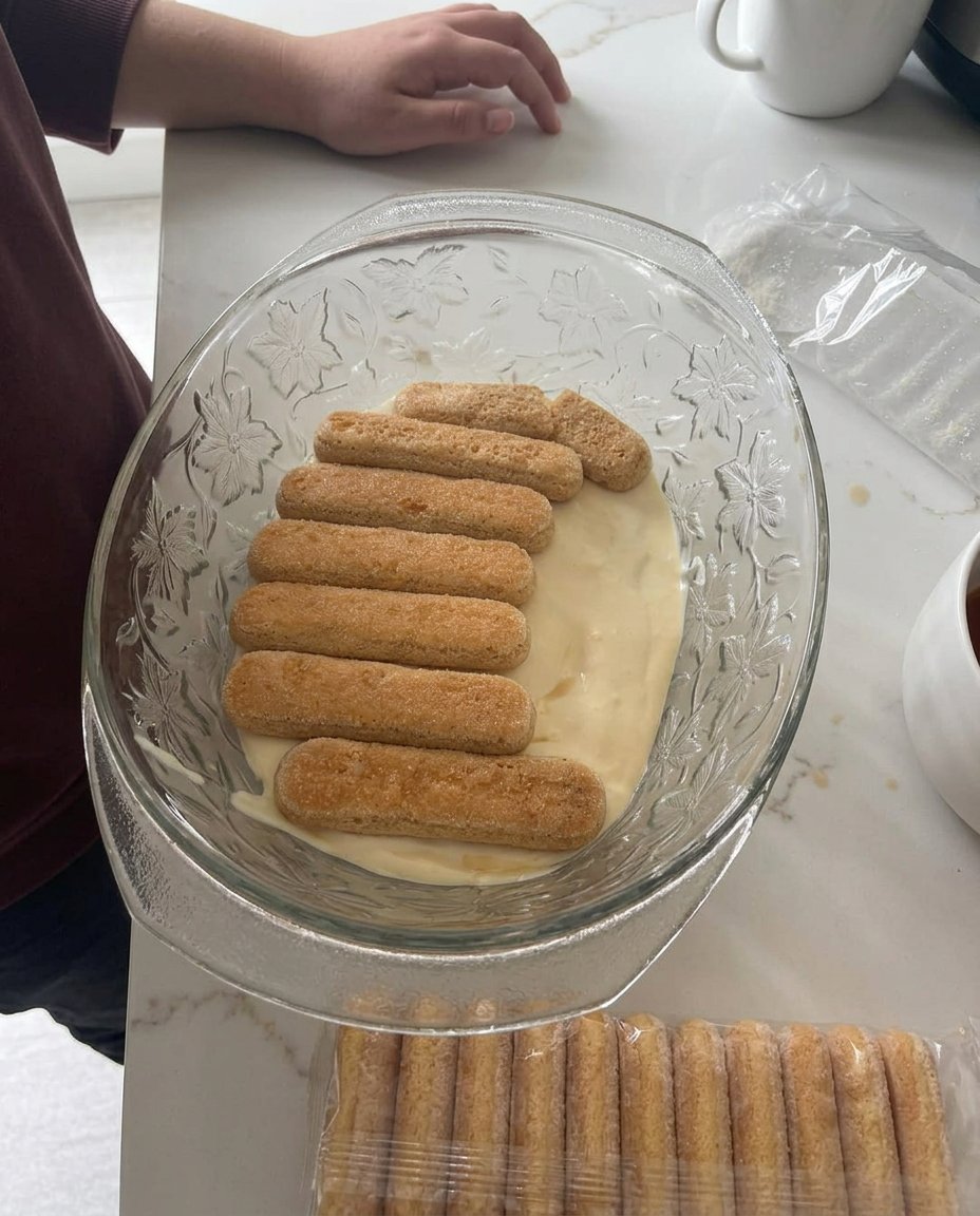 Fresh peaches, mascarpone cheese, ladyfingers, and heavy cream on a counter