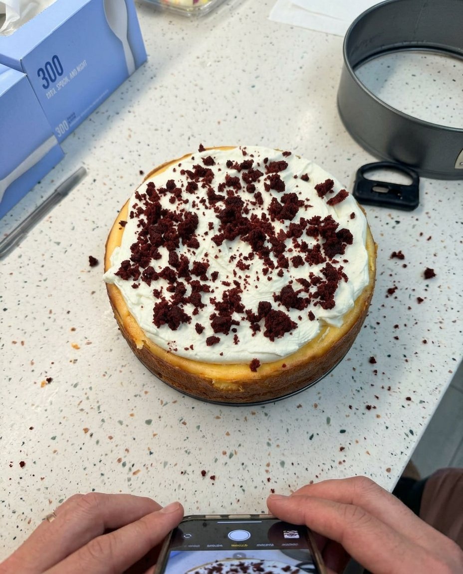Red Velvet Cheesecake 14 A slice of red velvet cheesecake served next to a cup of coffee.