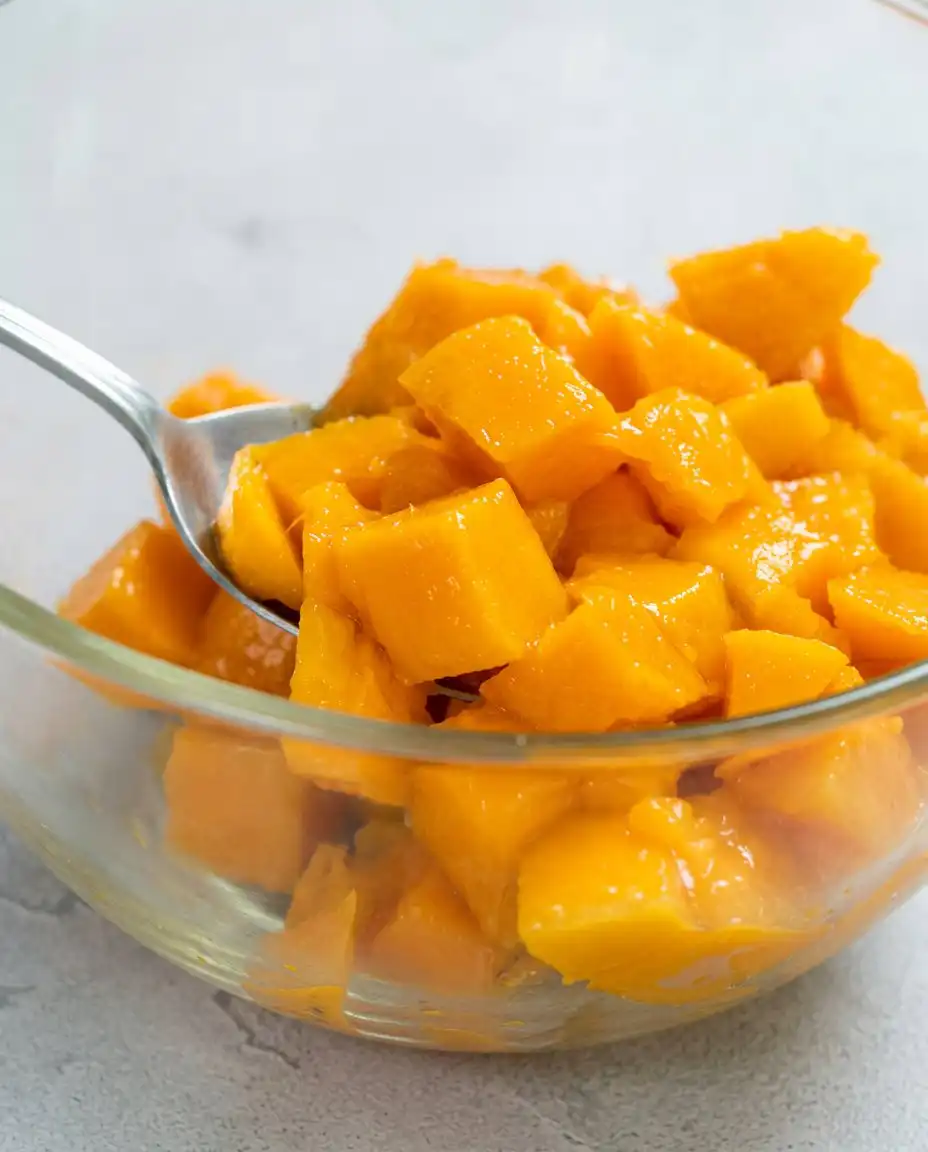 Ingredients for a mango butter cake including fresh mangoes eggs flour and butter