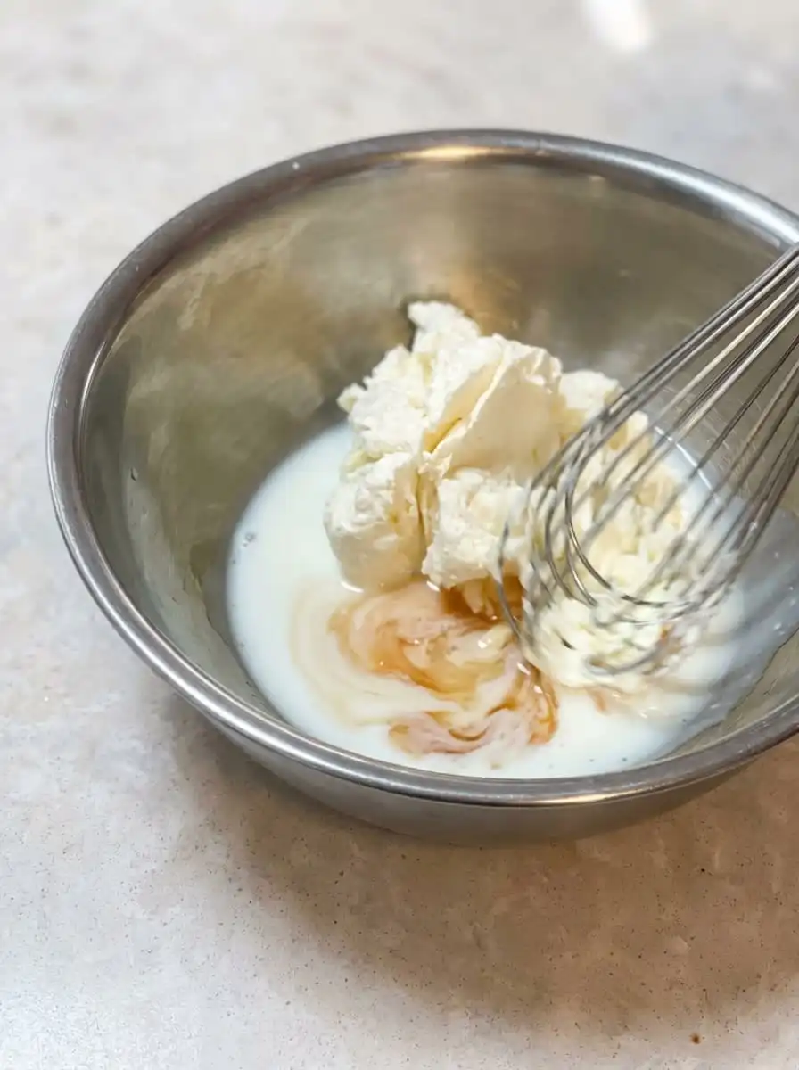 The simple pantry ingredients for making a Mango Yogurt Cake arranged neatly on a wooden kitchen counter.