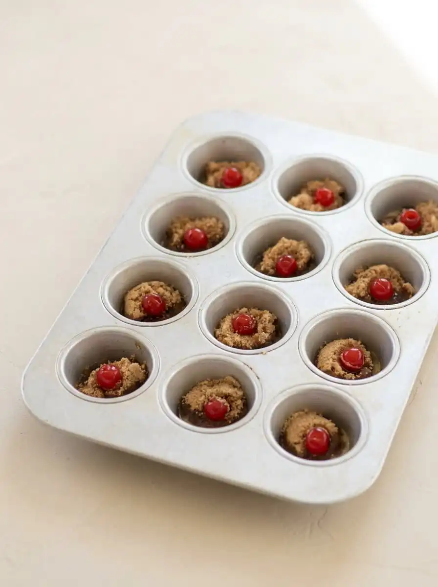 Pineapple Upside Down Cupcakes 14 Canned crushed pineapple brown sugar cherries and cake mix on a rustic counter